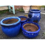 Collection of four blue glazed garden pots