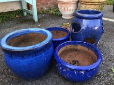 Collection of four blue glazed garden pots