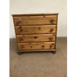 Pine furniture, modern chest of drawers, run of 4 drawers on bun feet approximately 86 x 44 x 85cm