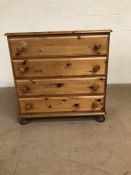 Pine furniture, modern chest of drawers, run of 4 drawers on bun feet approximately 86 x 44 x 85cm