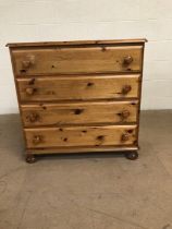 Pine furniture, modern chest of drawers, run of 4 drawers on bun feet approximately 86 x 44 x 85cm