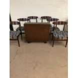 Mid century furniture, Dining set comprising of a drop leaf table and 6 chairs, the table with 2