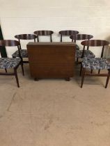 Mid century furniture, Dining set comprising of a drop leaf table and 6 chairs, the table with 2