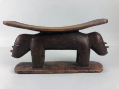 African Tribal neck rest, carved wooden neck rest in the shape of 2 Rhino end to end approximately