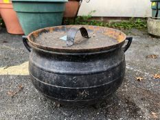 Metal lidded pot on three feet approx 22cm tall