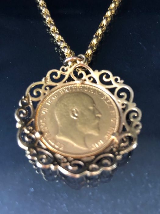 A 1910 Full Gold sovereign in a pierced and scrolling style mount on a Long 9ct Gold chain (approx - Image 2 of 8