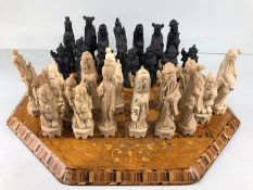 Chess set, antique wooden marquetery chess board and a chess set of Chinese immortals made from