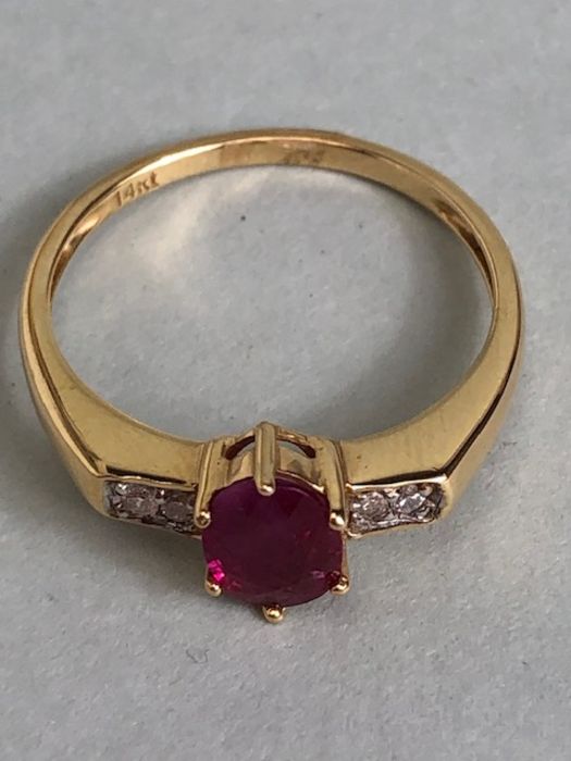 14ct Gold ring set with Oval faceted Ruby in claw setting with pair of diamonds to each shoulder - Image 5 of 7