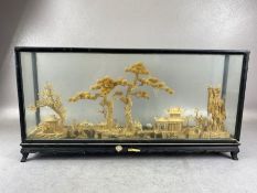 Oriental interest, Chinese carved cork diorama of a village scean in black lacquered glass case ,