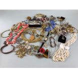 Costume Jewellery, a Quantity of vintage costume jewellery to include strings bead s, broaches