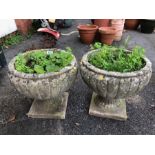 Pair of concrete garden planters approx 34cm tall