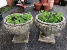 Pair of concrete garden planters approx 34cm tall