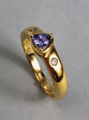 18ct Gold ring set with Triangular faceted Tanzanite stone with diamond shoulders size approx 'O'