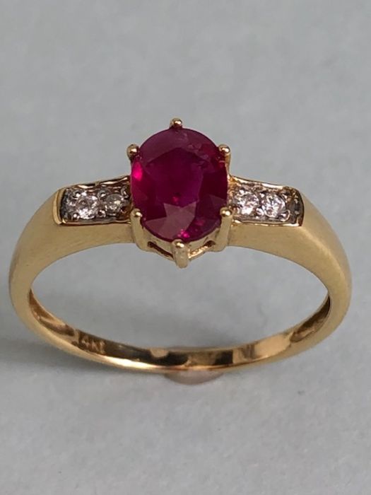 14ct Gold ring set with Oval faceted Ruby in claw setting with pair of diamonds to each shoulder - Image 2 of 7