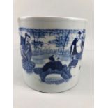 Oriental blue and white Chinese brush pot decorated with people, six character marking to base