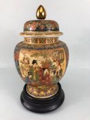 Large Japanese oriental Satsuma Ginger Jar with lid in wooden plinth with floral panels and people