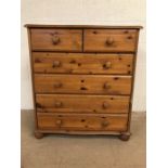 Pine chest of drawers, modern pine with run of 4 drawers and 2 above on bun feet approximately 85