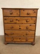 Pine chest of drawers, modern pine with run of 4 drawers and 2 above on bun feet approximately 85