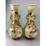 Japanese Vases, a pair of pottery vases with hand painted and enamel designs of birds and