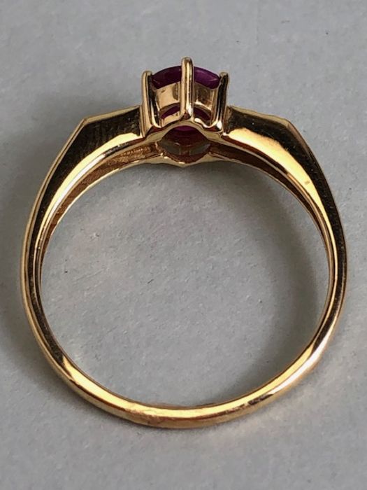 14ct Gold ring set with Oval faceted Ruby in claw setting with pair of diamonds to each shoulder - Image 7 of 7