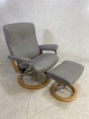 Grey leather 'Stressless' reclining swivel armchair with matching footstool
