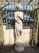 Garden statue of a scantily clad maiden on a plinth approx 200cm tall made from plastic or resin