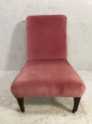 Pink upholstered bedroom or nursing chair on tapering front legs on original castors