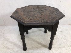 Octagonal carved oak occasional table approx 60cm x 60cm x 52cm