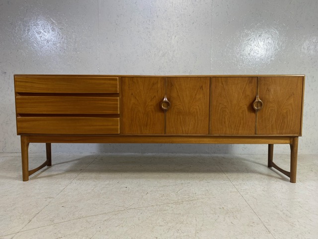 Mid Century sideboard by A.H. McIntosh & Co Ltd with three drawers to the left hand side,