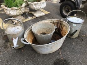 Collection of galvanised garden items to include Watering cans, bath metal sign etc