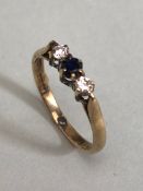 9ct Gold three stone diamond and Sapphire set ring size approx 'K'