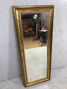 Rectangular gilt framed bevel edged mirror, approx 133cm x 53cm