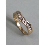 9ct yellow gold wishbone ring set with 11 diamonds size K approximately 1.60g inclusive