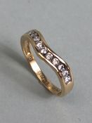 9ct yellow gold wishbone ring set with 11 diamonds size K approximately 1.60g inclusive