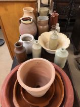 Collection of terracotta and stoneware items to include vintage bottles, and a Slipware jug