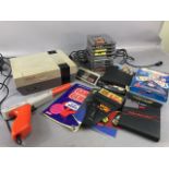 Nintendo Entertainment System 1989 , along with target gun, Game Genie, video game Enhancer, and a