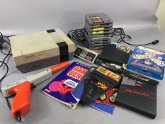 Nintendo Entertainment System 1989 , along with target gun, Game Genie, video game Enhancer, and a