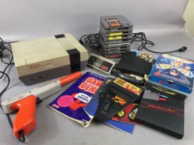 Nintendo Entertainment System 1989 , along with target gun, Game Genie, video game Enhancer, and a