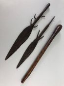 Tribal interest, Hand forged Iron spear heads and an Aboriginal wooden club