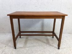 Mid century style occasional table on castors
