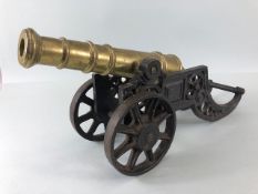 Military interest, large vintage model of a Cannon, brass barrel on metal carriage approximately