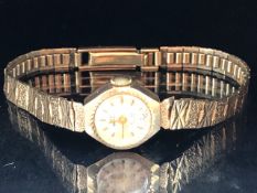 9ct Gold watch by Swiss Empress on a 9ct Gold strap with a 21 Jewel Incabloc movement, total