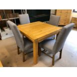 Modern pine effect square legged table and four grey upholstered chairs. Table extends to double