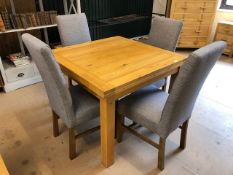 Modern pine effect square legged table and four grey upholstered chairs. Table extends to double