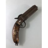 Antique gun, Eastern multi barrel percussion pistol, grip and frame in laid with yellow and white