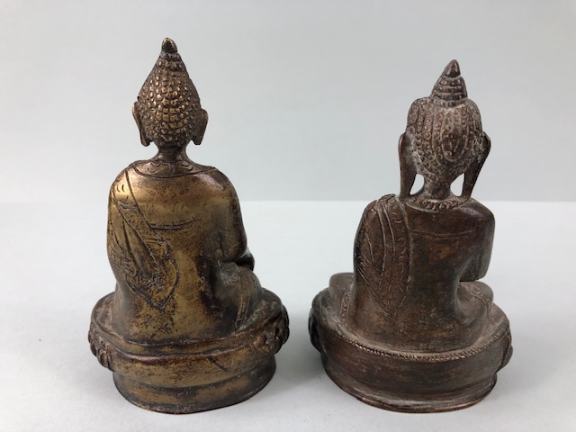 oriental interest , two patinated Tibetan brass Buddha statues the bases still containing casting - Image 2 of 6