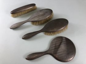 Hallmarked Silver dressing table items to include a circular bevel edged mirror and three brushes (