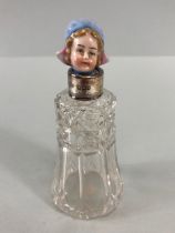 English hallmarked silver mounted sent bottle with china headed stopper of a dutch Girl,