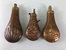Military Interest, Three copper and brass Black powder Flasks, 2 embossed with animals the third