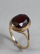 9ct gold ring set with a faceted garnet stone approx 11mm x 8mm and ring size 'L'